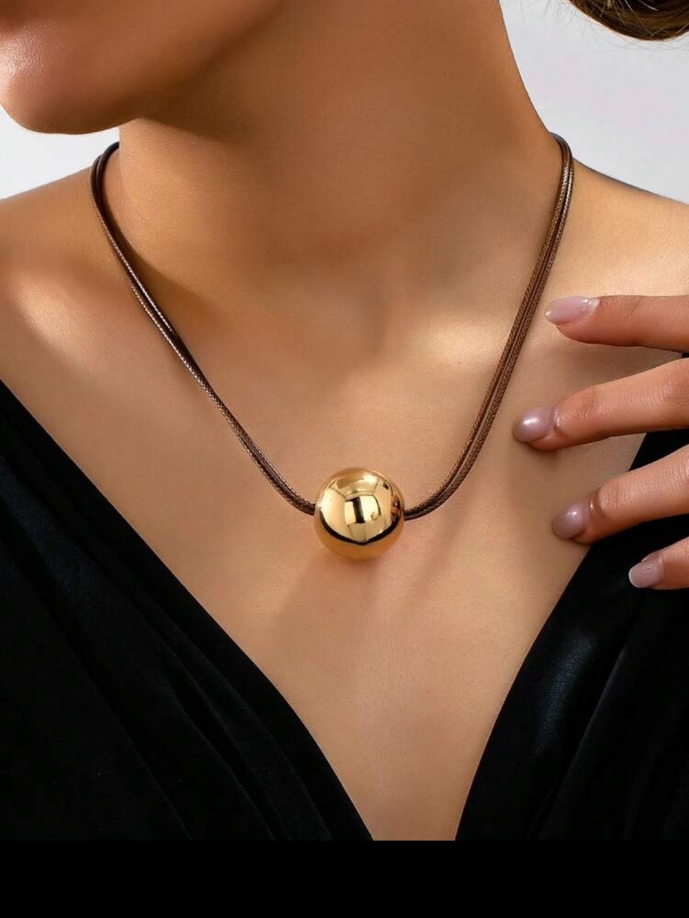 Gold Tone Orb Pendant on Brown Cord